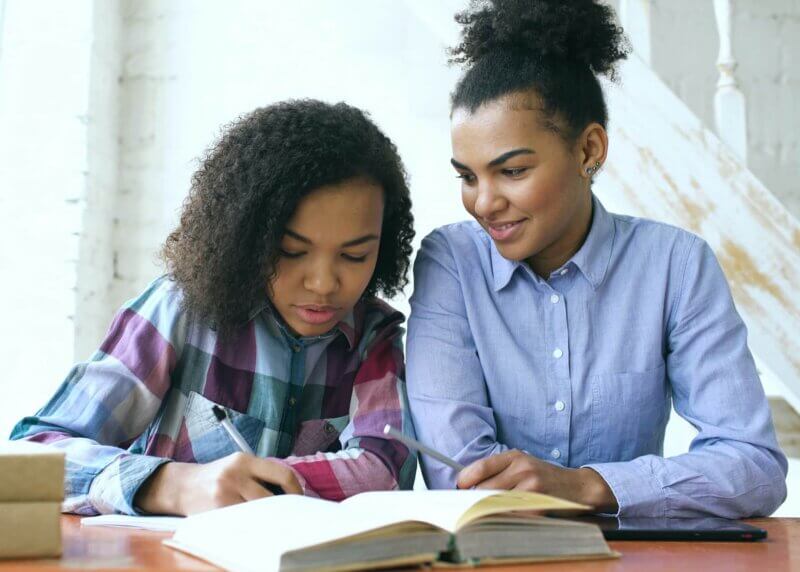 woman supporting a student in body doubling