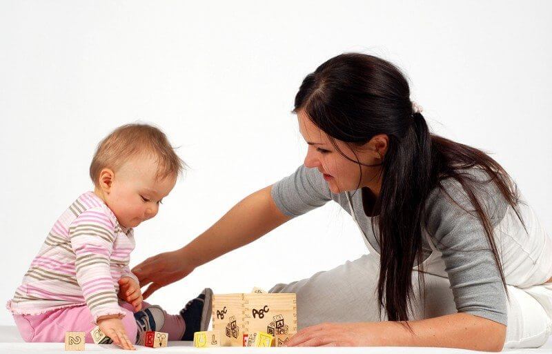 photo of mother and daughter having fun at home