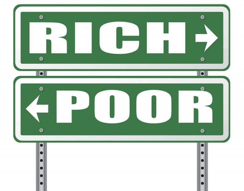 rich or poor take financial risk live in wealth good or bad luck and change fortune wealthy or poverty road sign arrow