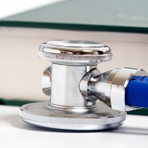 Stethoscope resting on a book